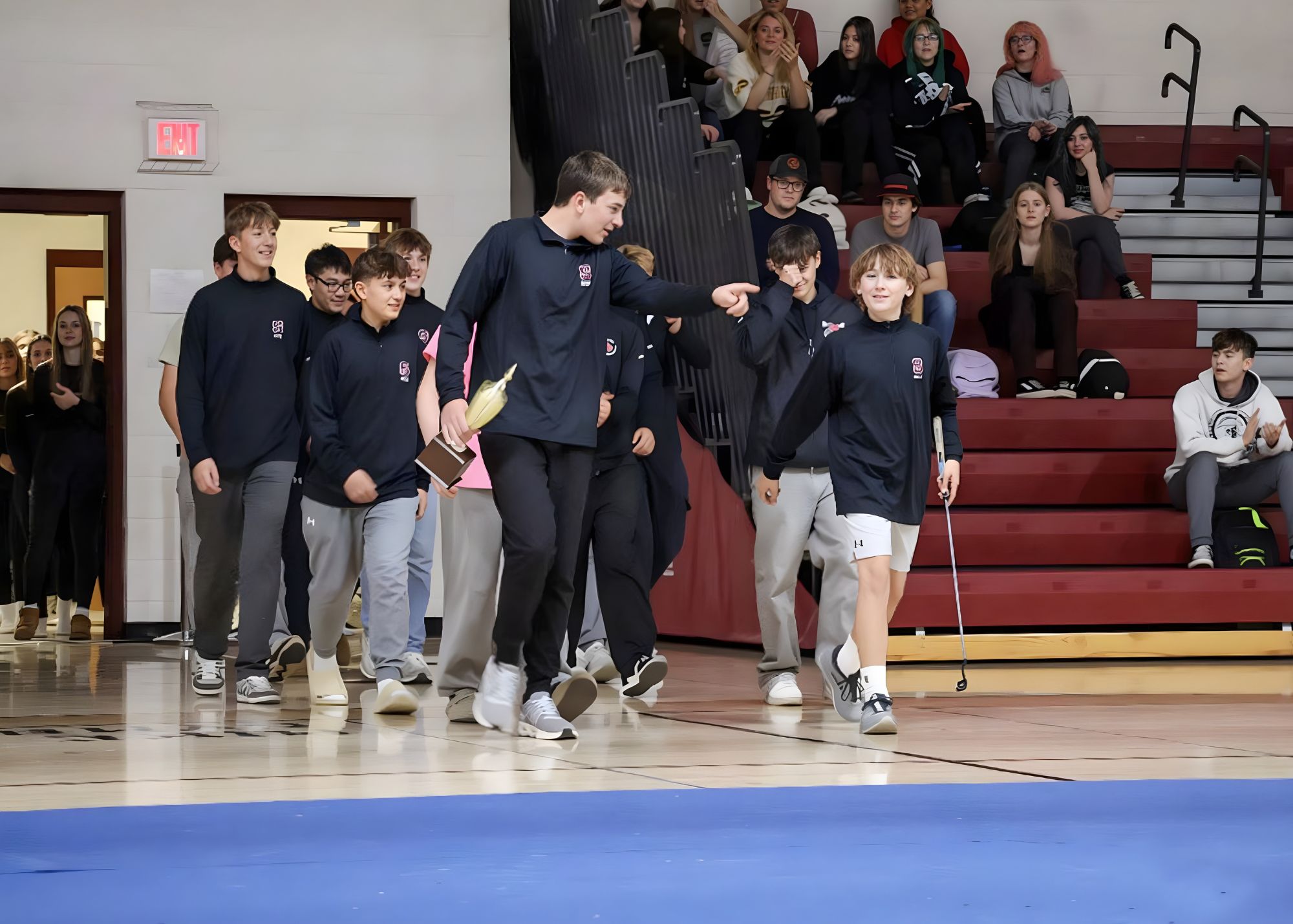 students standing together posing for photo for sports event