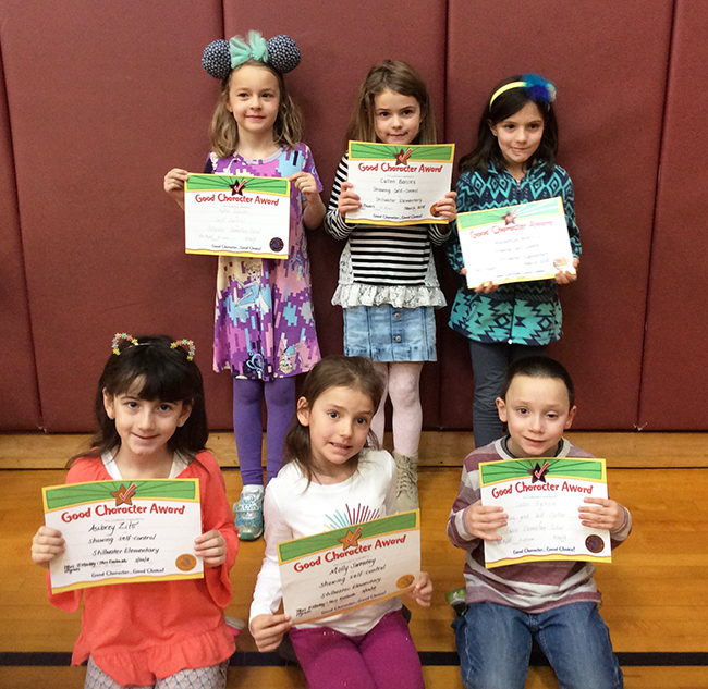 1st graders pose with their Character Education Leader Awards