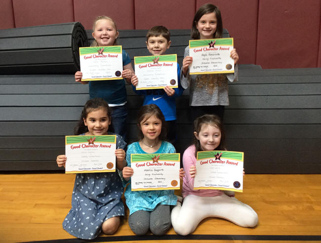 1st graders pose with their Character Education Leader Awards