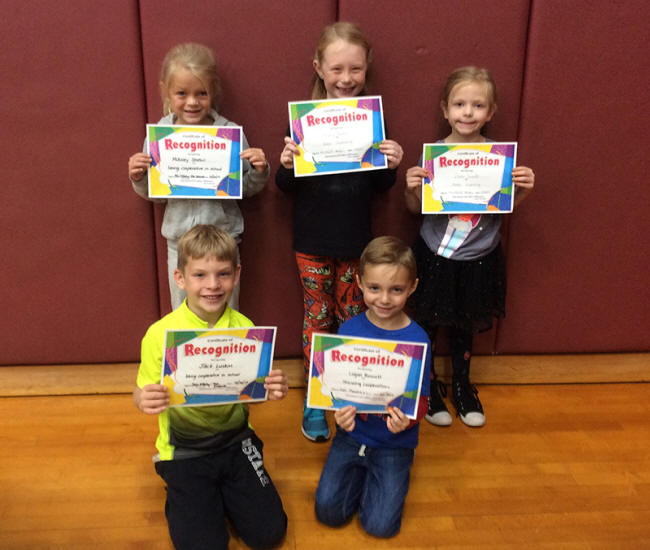 1st graders pose with their Character Education Leader Awards