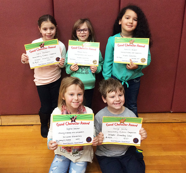 1st graders pose with their Character Education Leader Awards