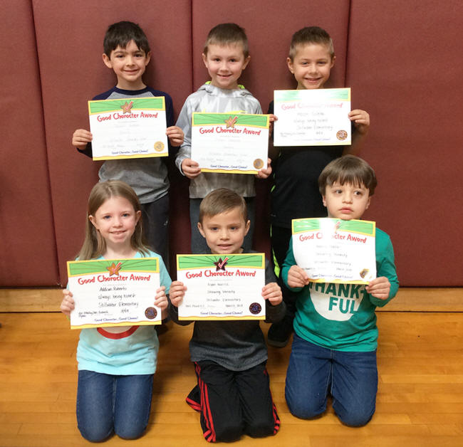 1st graders pose with their Character Education Leader Awards