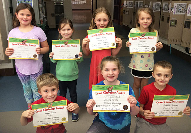 1st graders pose with their Character Education Leader Awards