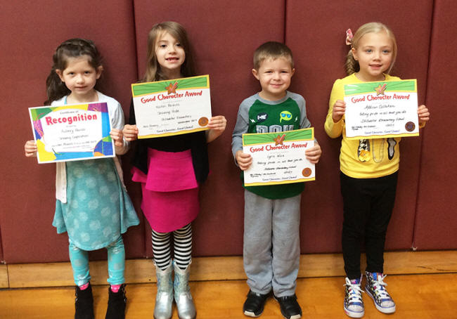 1st graders pose with their Character Education Leader Awards