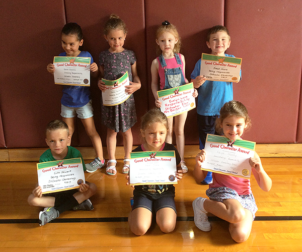 1st graders pose with their Character Education Leader Awards