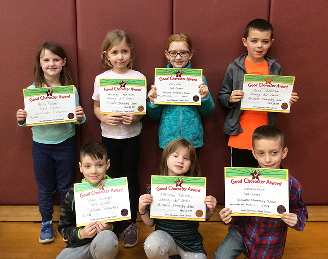 2nd graders pose with their Character Education Leader Awards