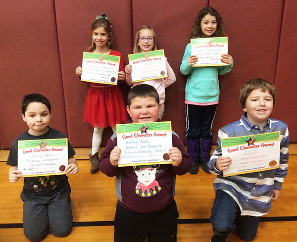 2nd graders pose with their Character Education Leader Awards