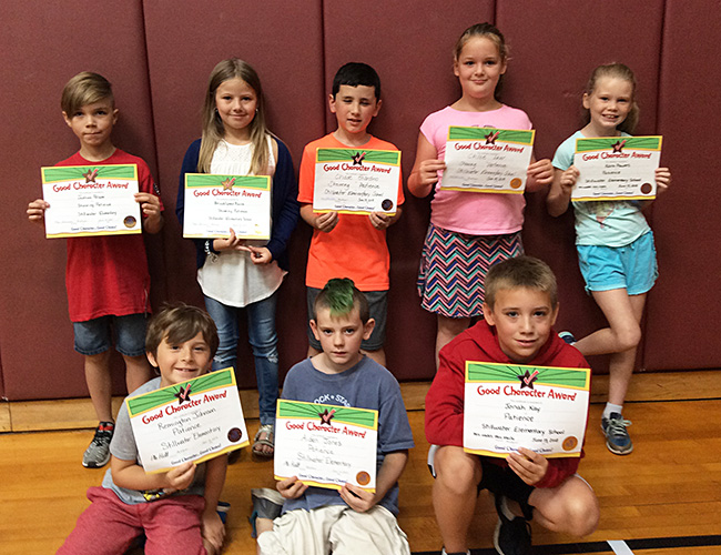 2nd graders pose with their Character Education Leader Awards