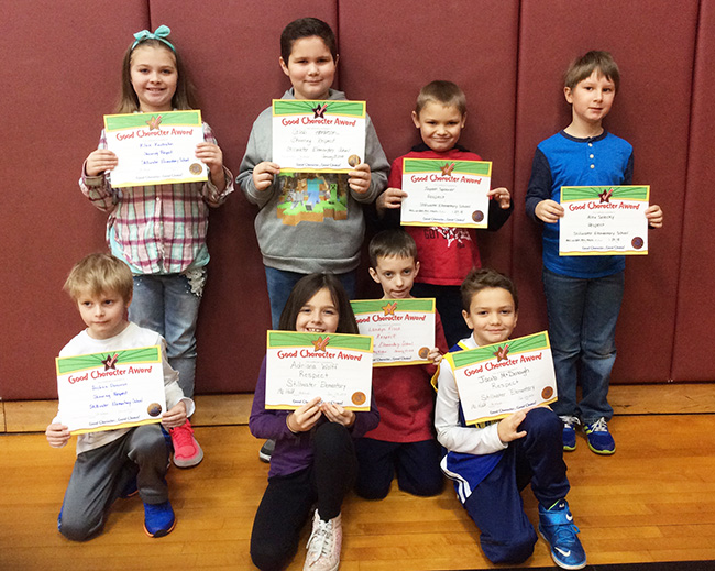 2nd graders pose with their Character Education Leader Awards