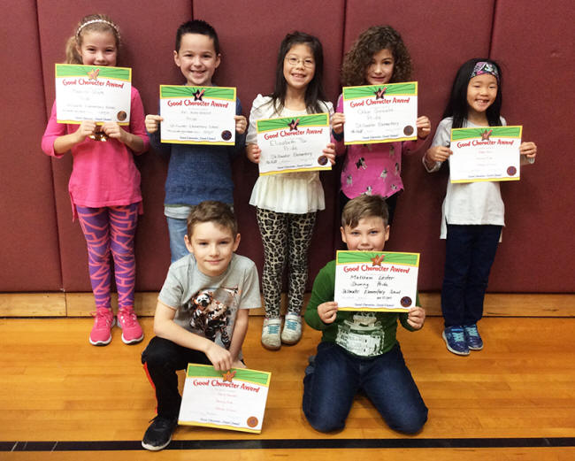 2nd graders pose with their Character Education Leader Awards