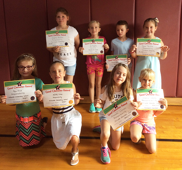 2nd graders pose with their Character Education Leader Awards