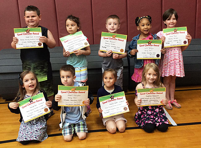 Kindergartners pose with their Character Education Leader Awards