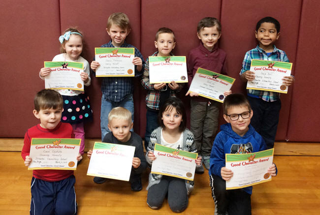 Kindergartners pose with their Character Education Leader Awards