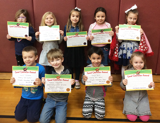 Kindergartners pose with their Character Education Leader Awards