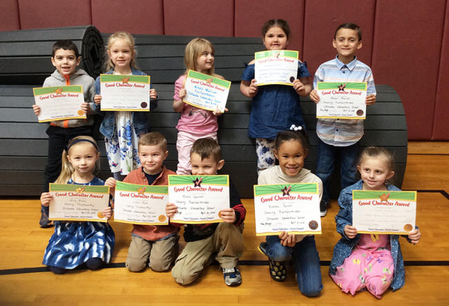 Kindergartners pose with their Character Education Leader Awards