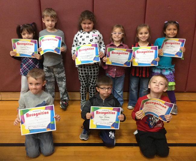 Kindergartners pose with their Character Education Leader Awards