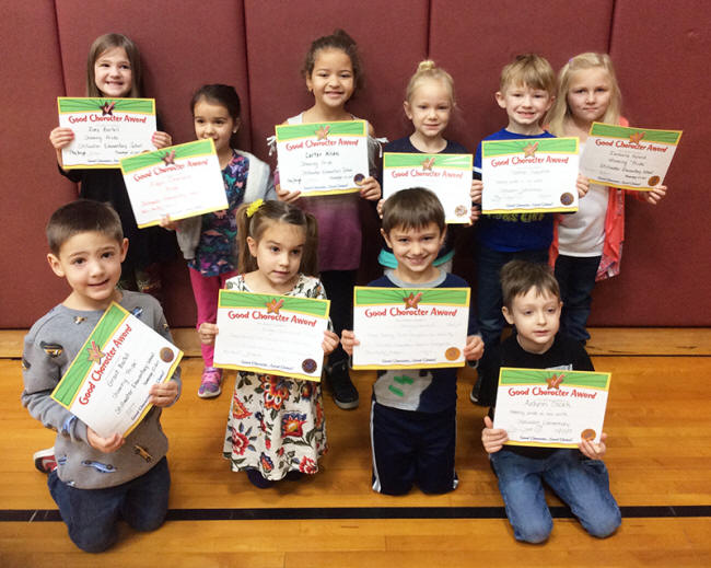 Kindergartners pose with their Character Education Leader Awards