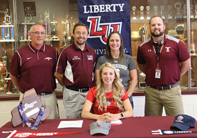 Faith Sheehan poses for a picture after signing her National Letter of Intent for Liberty University.