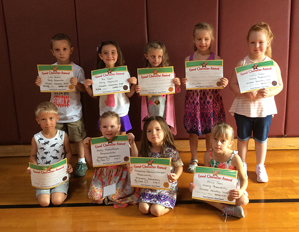 Kindergartners pose with their Character Education Leader Awards