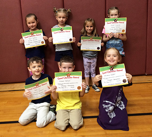 Kindergartners pose with their Character Education Leader Awards