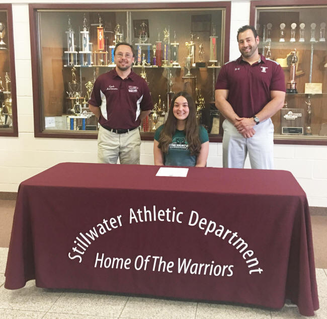 Madison Krochina poses for a picture after signing her National Letter of Intent to attend Binghamton University