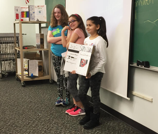 A group of students presents their invention during a "Shark Tank" event
