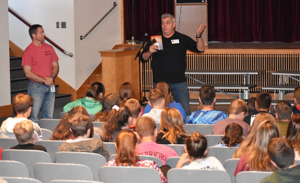 John Gray standing in front of students