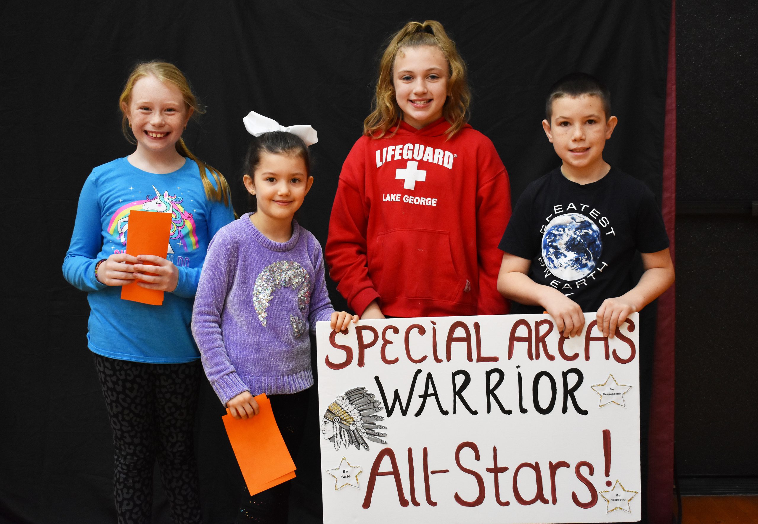 Students lined up with the specials warrior sign