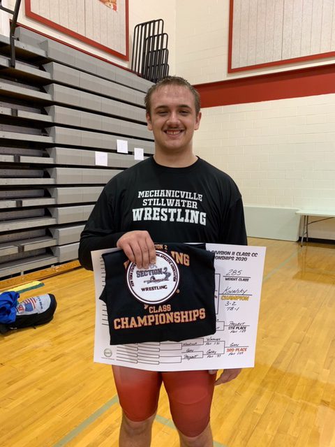 Justyn holding awards