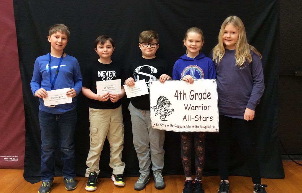 Five students standing with fourth grade warrior all-star sign