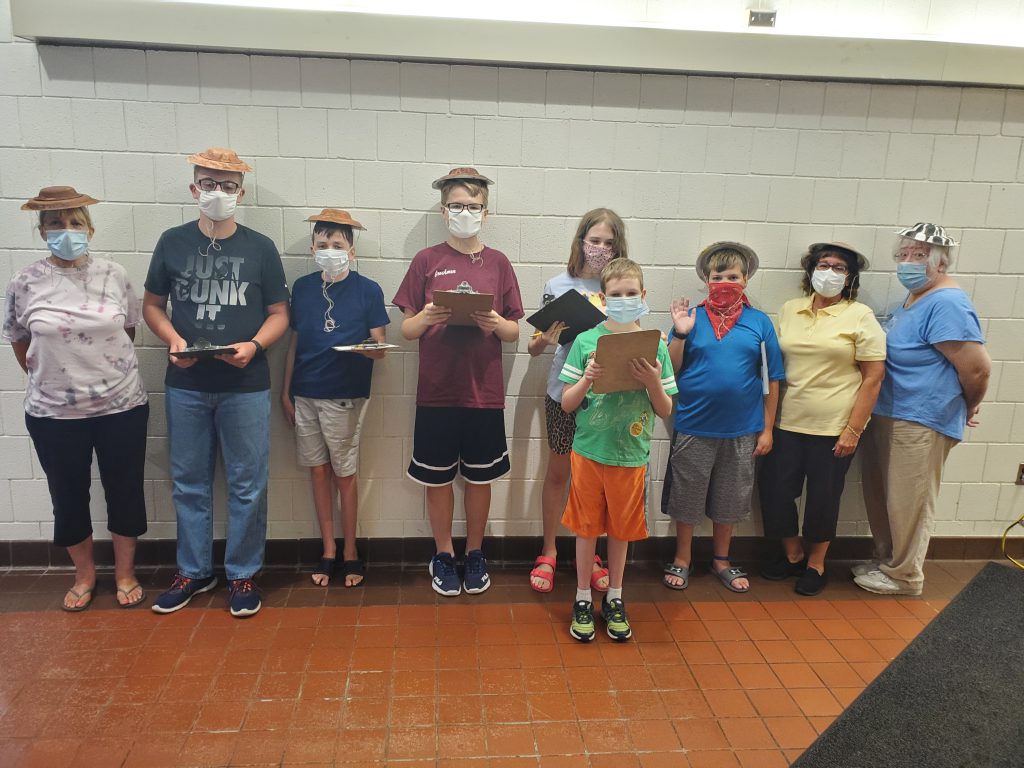 Students in ESY program standing with hats they made