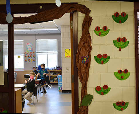 Students learning in classroom in decorated quad 