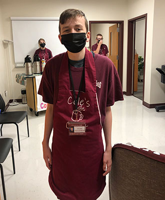student wearing apron 