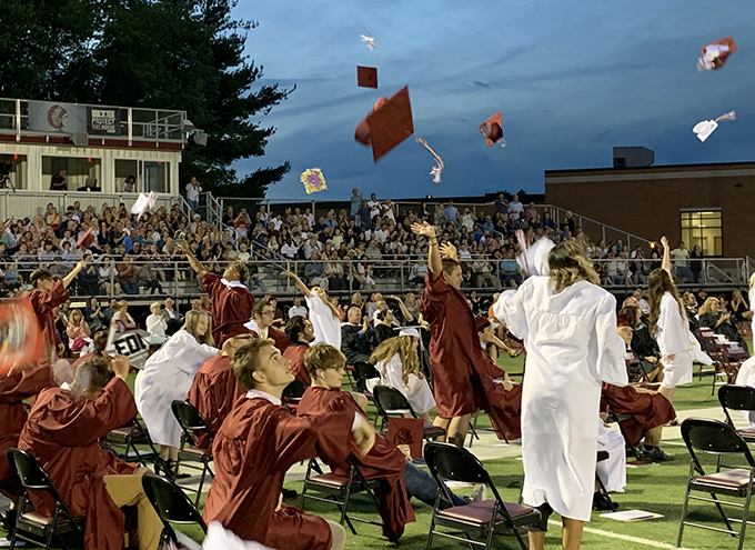 Class of 2021 tossing their graduation caps