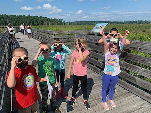 students exploring the Round Lake Preserve