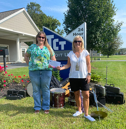 Jeannie Dickinson from TCT and Patti Morris with instruments and check
