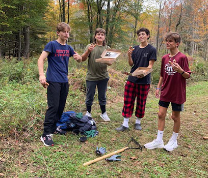 students in a group having lunch outside