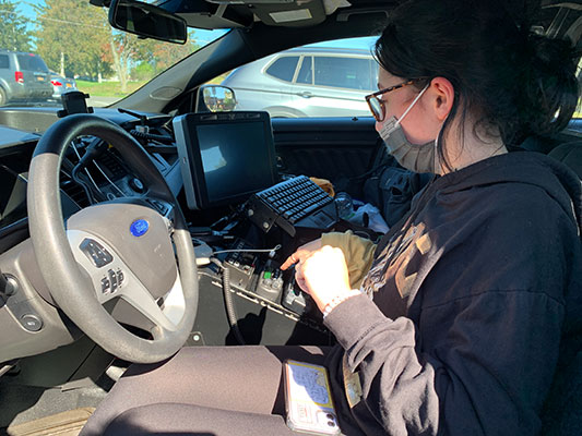 Shayla Colarusso inside Deputy Sean Lyons's patrol car