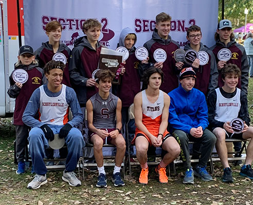 Section 2 athletes sitting and standing as a group