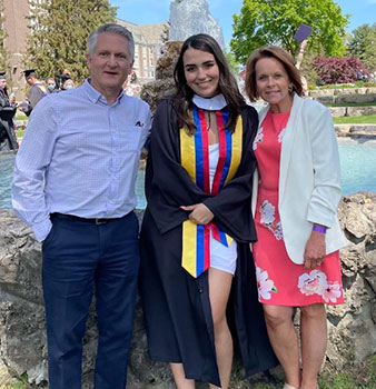 Aimee with her parents at Nazareth graduation