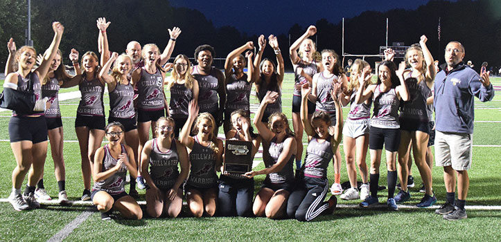 team and coaches raising arms and hands, cheering