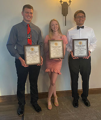 Ryan, Paige, Tai holding plaques