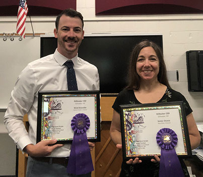 Mr. Foxton and Mrs. Pitkin holding awards