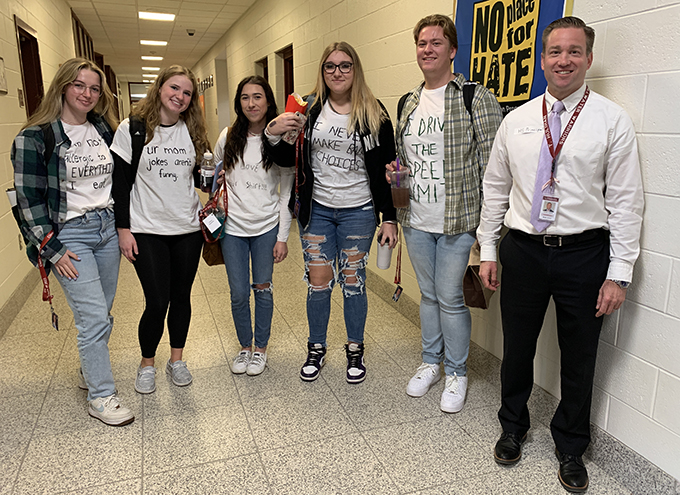 students and MS principal wearing white lie t-shirts during Spirit Week