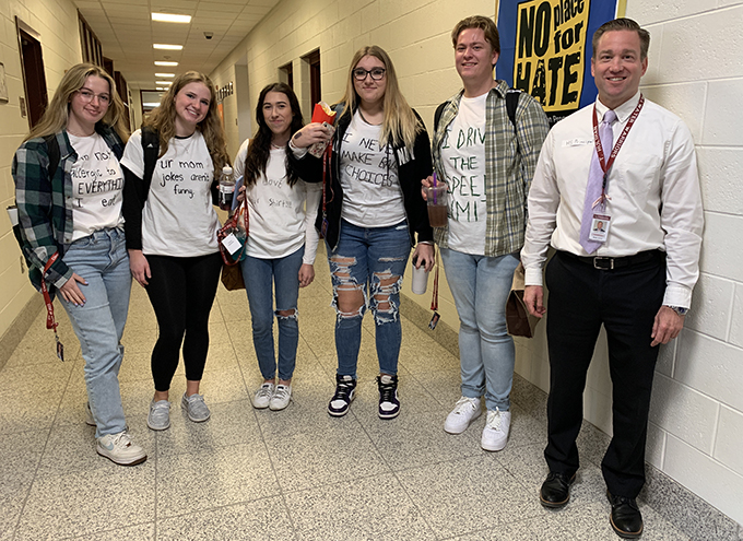 students and MS principal wearing white lie t-shirts during Spirit Week