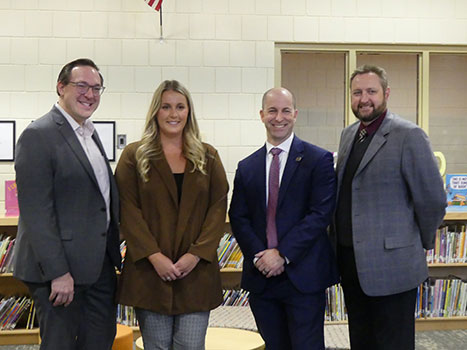 From left, standing in a group: Chris White, Abby Higgins, Christopher Pinheiro, Charles MacNeil