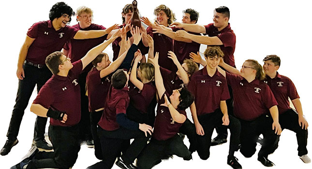 bowling team members holding and reaching hands toward trophy