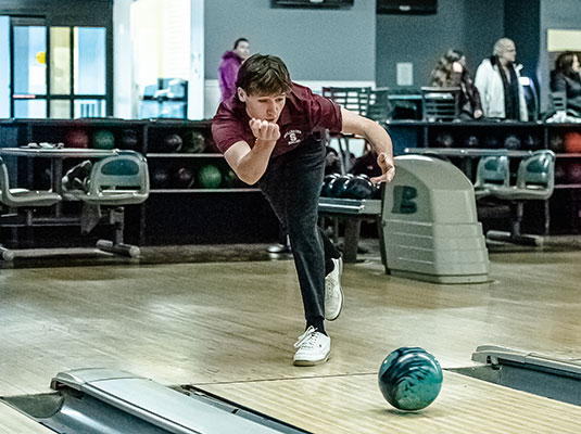 Connor Julian bowling. Photo by Bob Dunn of Converged Imaging