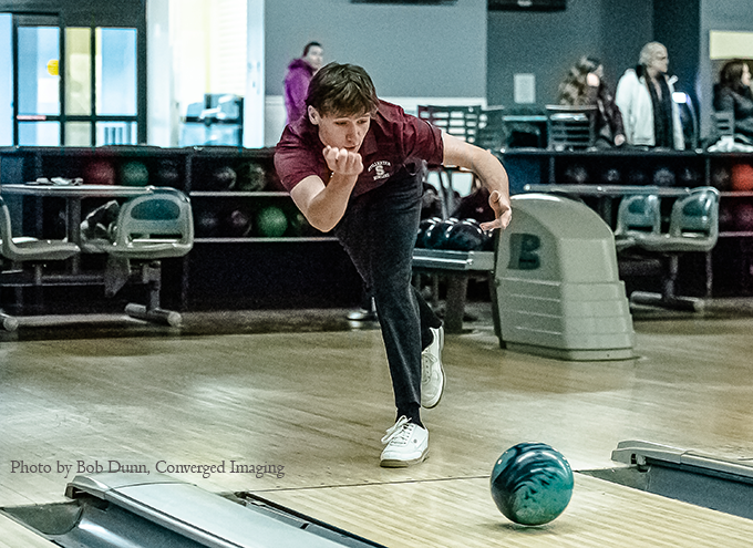 Connor Julian bowling. Photo by Bob Dunn, Converged Imaging