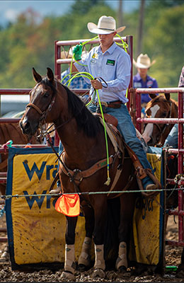 Caleb in the saddle on his horse, Stitch